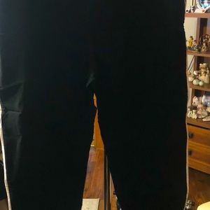Terra & Sky black pants with white stripe down the legs